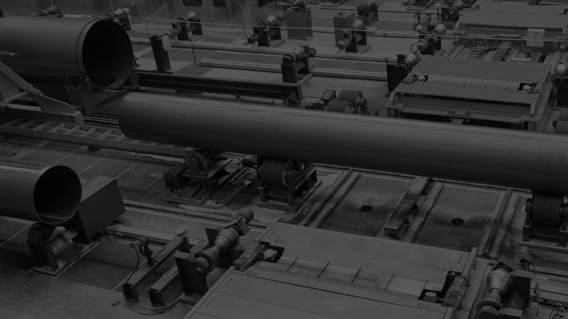 A darkened black and white image of a custom fabrication being manufacturer.