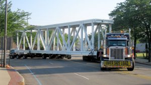 A steerable dolly making a turn with a oversize bridge section