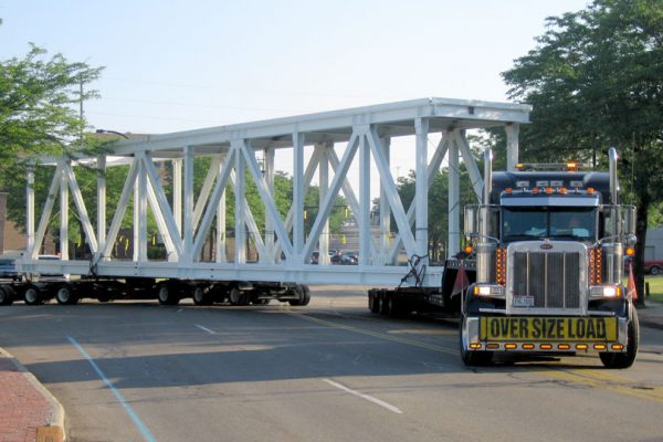 A steerable dolly making a turn with a oversize bridge section