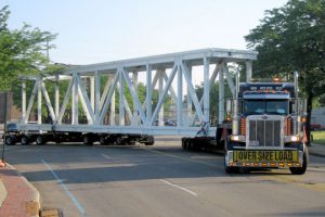 A steerable dolly making a turn with a oversize bridge section